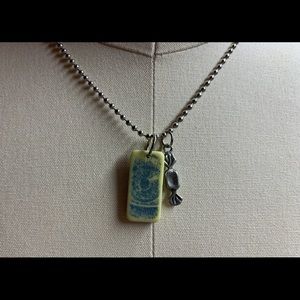 Eye candy, repurposed domino necklace.